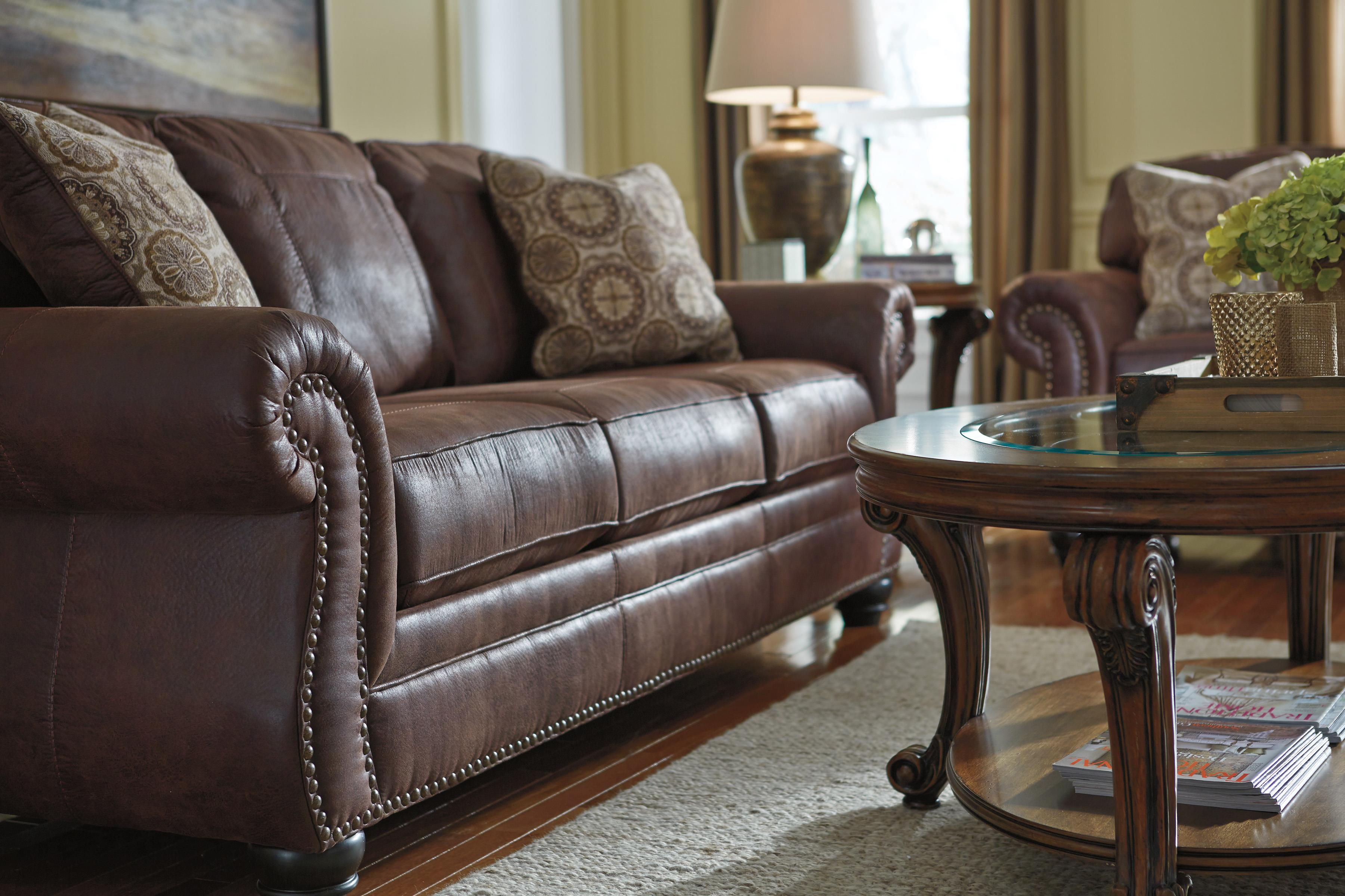 Benchcraft Breville Faux Leather Sofa with Rolled Arms and Nailhead